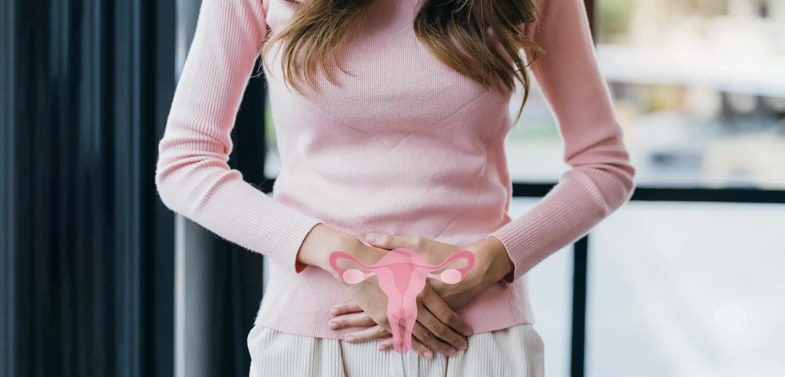Woman holding lower abdomen, uterus overlay.